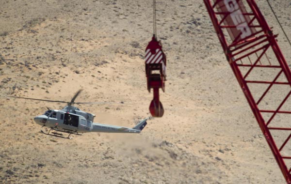 An official helicopter flies next to the rescue plattform before the start of the rescue operation of the 33 trapped miners at the San Jose mine near Copiapo, Chile. (EPA)