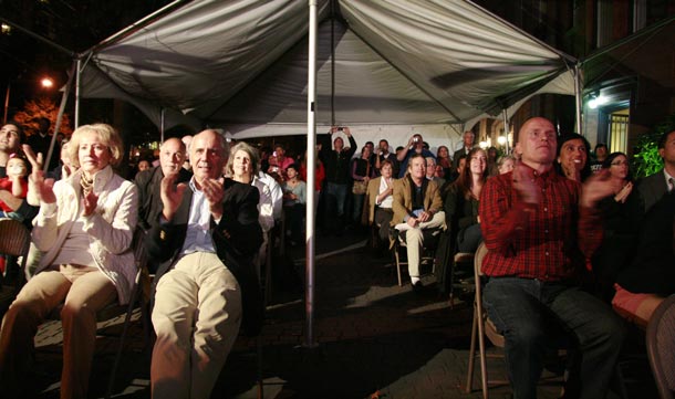 People watch the rescue operation of 33 miners trapped in Chile on a large screen at the Chilean Embassy in Washington, DC. A complex, against-all-odds rescue of 33 miners trapped in Chile for more than two months transfixed this nation and the world, with wild celebrations breaking out at its successful completion late at night. Approximately 250 persons met at the embassy to watch the rescue operation in San Jose. (AFP)