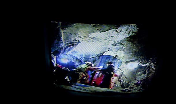 A video still made available by EFE shows the rescue of Chilean miner Ariel Ticona inside the capsule Phoenix going from 700 meters underground up to the surface at the San Jose mine, Copiapo, Chile. The 33 miners were trapped 700 meters underground, since last 5 August. (EPA)