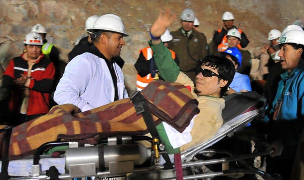 Chilean miner Pedro Cortes is taken to hospital on a stretcher after being rescued from 700 meters underground to the surface in the capsule Fenix at the San Jose mine, Copiapo, Chile. (EPA)