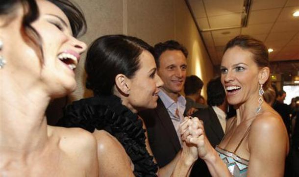 Cast member Hilary Swank greets co-stars Minnie Driver and Juliette Lewis at the premiere of "Conviction" at the Samuel Goldwyn theatre in Beverly Hills. (REUTERS)