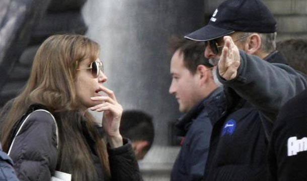 Angelina Jolie talks to cast members during the filming of her first movie "Untitled Bosnian War Love Story" in central Budapest. (REUTERS)