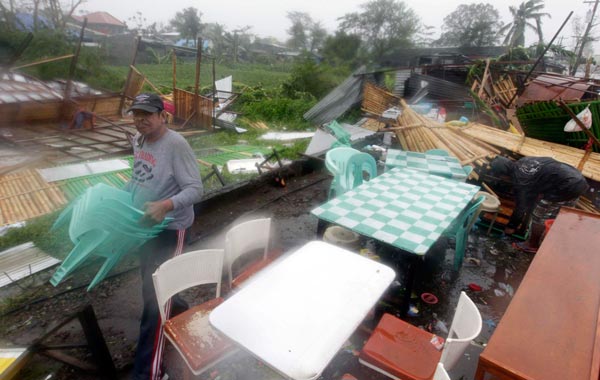 Filipinos salvage their belongings after their house was damaged by typhoon Megi in Isabela province, northern Philippines. (EPA)