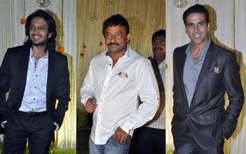 Indian Bollywood actor Ritesh Deshmukh, director Ram Gopal Varma and Akshay Kumar pose during newly wed Vivek Oberoi and Priyanka Alva's reception party in Mumbai. (AFP)