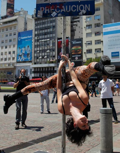 Zully Ochoa performs a pole dancing routine to promote the Miss Pole Dancing Southamerica 2010 competition in Buenos Aires. (REUTERS)