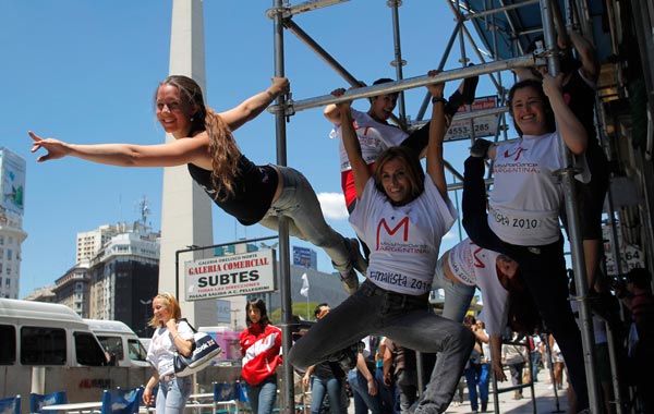 Women perform a pole dancing routine to promote the Miss Pole Dancing Southamerica 2010 competition in Buenos Aires. (REUTERS)