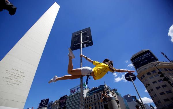 A dancer performs in the street on Friday Nov.5, 2010 while promoting the "Miss Pole Dance Sudamerica 2010" competition to be held Saturday in Buenos Aires, Argentina. (AP)