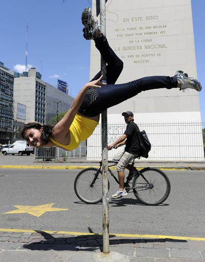 A Brazilian competitor in the Miss Pole Dance Sudamerica 2010, performs in front of the Obelisk, in downtown Buenos Aires. (AFP)