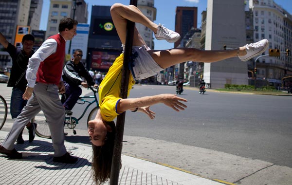 A dancer performs in the street on Friday Nov.5, 2010 while promoting the "Miss Pole Dance Sudamerica 2010" competition to be held Saturday in Buenos Aires, Argentina. (AP)