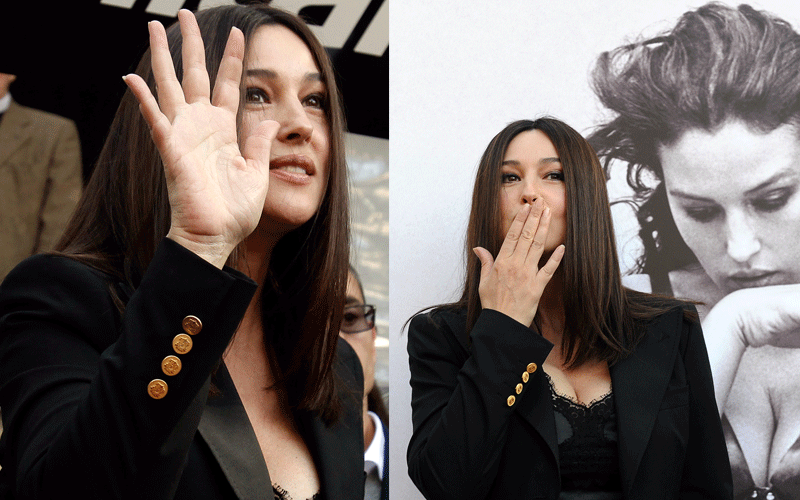 Italian actress Monica Bellucci waves as she poses for photographers on the occasion of the presentation of a photo book with an introduction by Oscar-winning Italian director Giuseppe Tornatore, in Rome, on Saturday. (AP)