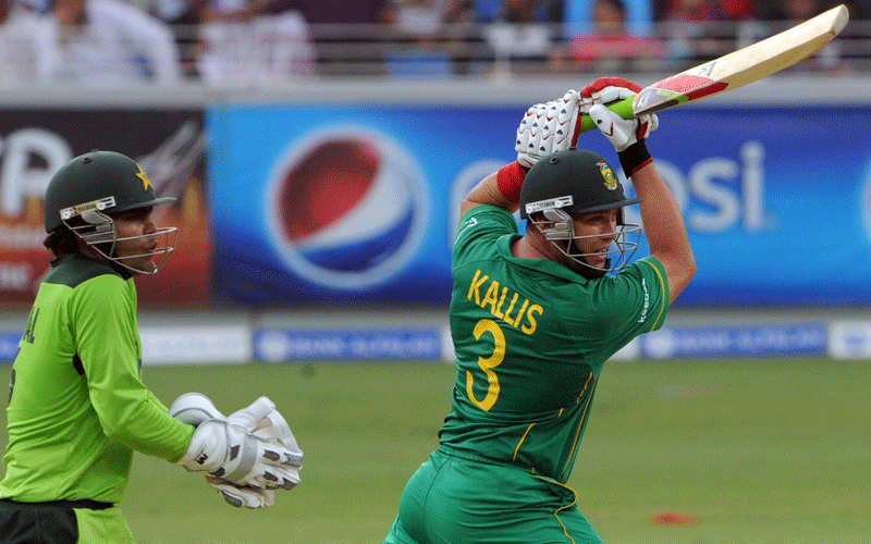 South African batsman Jacques Kallis plays a shot as Pakistani wicketkeepr Umar Akmal looks on during the fifth one-day international at the Dubai cricket Stadium on Monday. (AFP)