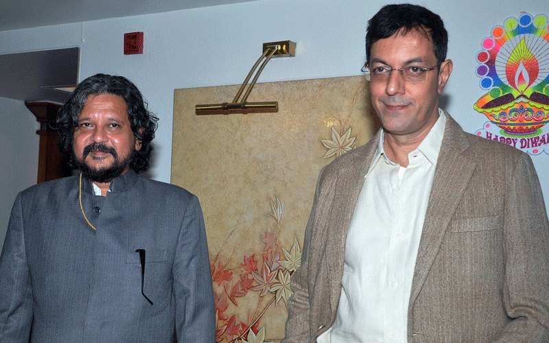 Indian Bollywood actors Rajat Kapur (R) and Amole Gupte pose during the music launch of the upcoming Hindi film “Phas Gaya Re Obama” directed by Subhash Kapoor in MumbaI. (AFP)