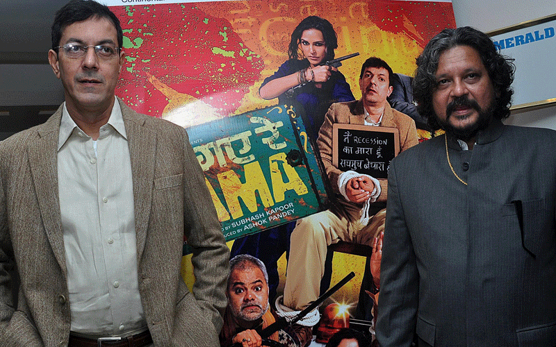 Indian Bollywood actors Rajat Kapur (L) and Amole Gupte pose during the music launch of the upcoming Hindi film “Phas Gaya Re Obama” directed by Subhash Kapoor in Mumbai. (AFP)