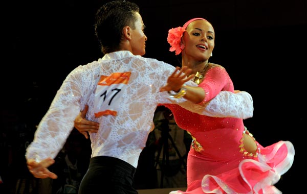 Khristina Ivolgina (R) and Akhmet Kalmatayev of Kazakhstan compete in the preliminary rounds of the dance sport event at the 16th Asian Games in Guangzhou. (AFP)