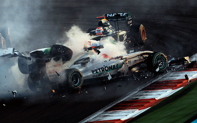 Mercedes GP's German driver Michael Schumacher crashes with Force India's Italian driver Vitantonio Liuzzi  at the Yas Marina circuit in Abu Dhabi, during the Abu Dhabi Formula One Grand Prix. (AFP)