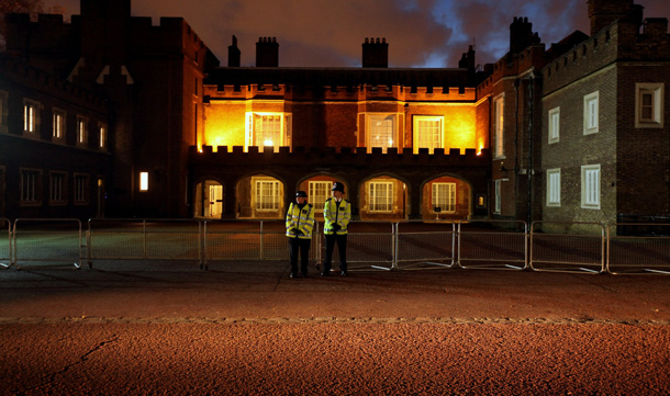 Two police officers stand guard outside Clarence House shortly after the announced engagement of Prince William and Kate Middleton in London, England. Prince William, who is second in line to the throne following his father Prince Charles, has been in a relationship with Ms Middleton for the past 8 years. They were engaged in October whilst on a private holiday in Kenya and are due to marry in London in the spring or summer 2011. (GETTY IMAGES)