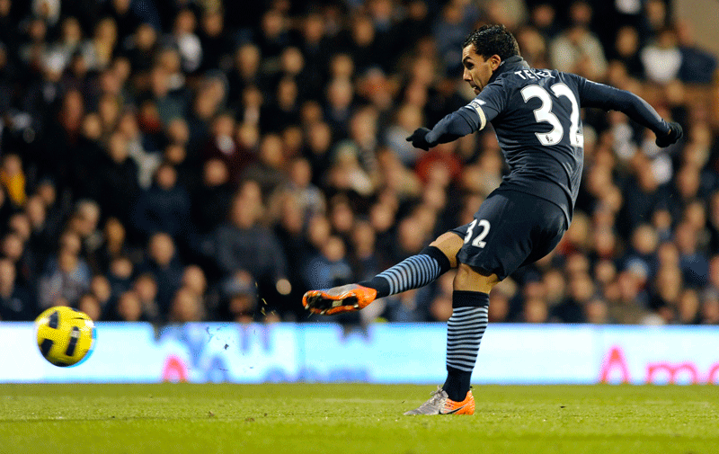 Manchester City’s Carlos Tevez scores against Fulham during their Premier League match at Craven Cottage in London on Sunday. (REUTERS)