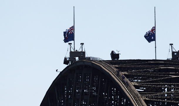 Flags on the Sydney Harbour Bridge are lowered at half mast in Sydney in remembrance of the 29 miners killed in the Pike River coal mine tragedy in neighbouring New Zealand. New Zealand Prime Minister John Key said on November 25 he wanted answers on what went "terribly wrong" in a colliery blast that killed 29 men, including two Australians, in the nation's worst mining disaster for almost a century. (AFP)