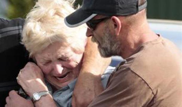 Family members of miners trapped underground in the Pike River coal mine react after learning of a second explosion in the mine at a briefing by mine authorities and police in Greymouth on New Zealand's west coast. (REUTERS)