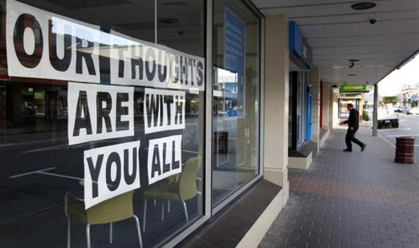 A sign in a Greymouth bank window shows support for 29 miners trapped underground in the Pike River coal mine. (REUTERS)