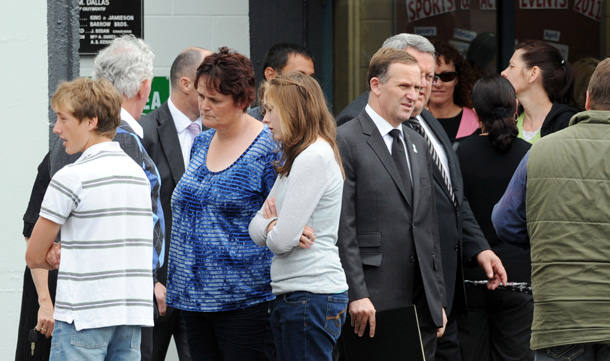 New Zealand Prime Minister John Key, center right, leaves a meeting of family and friends of the 29 miners and contractors killed in the Pike River mine explosion, in Greymouth, New Zealand. (AP)