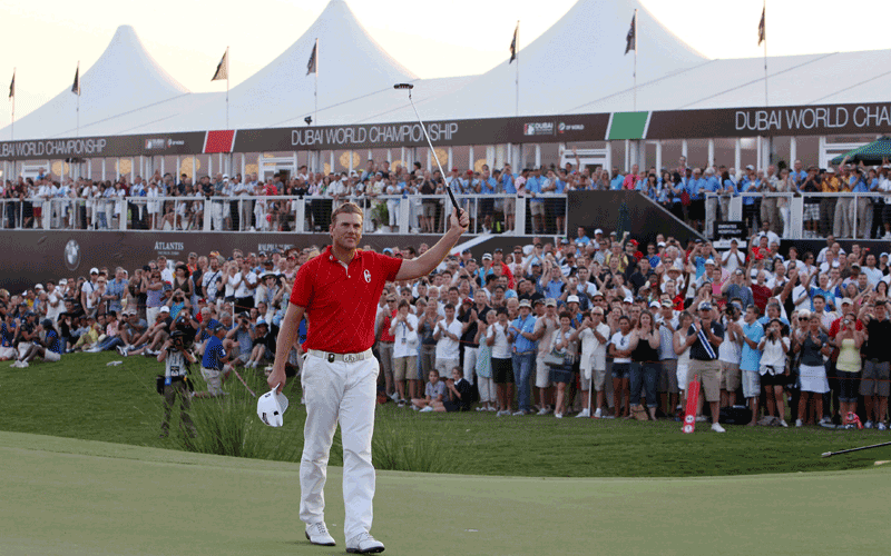 Robert Karlsson of Sweden acknowledges the crowd after winning the Dubai World Championship at the Earth Course of the Jumeirah Golf Estates in the Gulf emirate. (AFP)