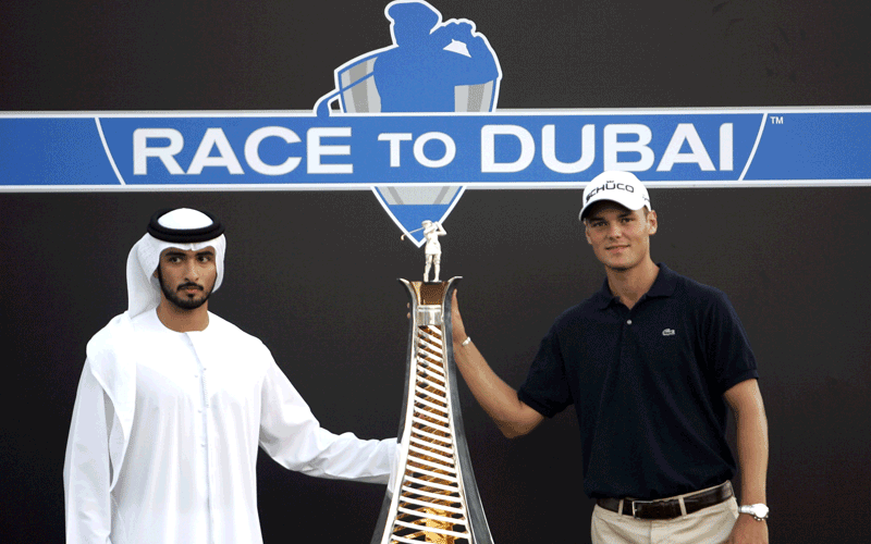 Germany's Martin Kaymer, right, with Sheikh Majid bin Mohammed Al Maktoum, and the trophy that Kaymer won for winning the European Tour money title at the season-ending Dubai World Championship in Dubai. (AP)