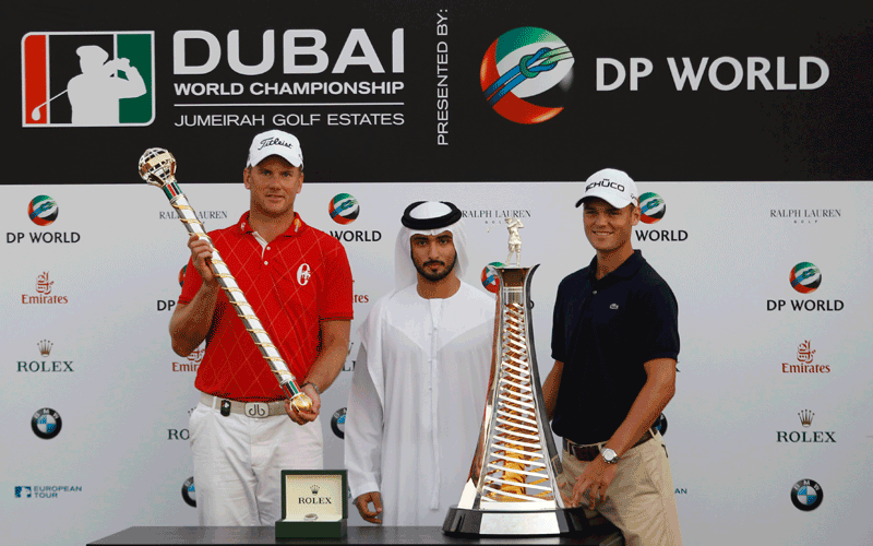 Race to Dubai winner Martin Kaymer (right) of Germany, tournament winner Robert Karlsson (left) of Sweden and Sheikh Majid bin Mohammed bin Rashid pose after the final round of the Dubai World Championship European PGA golf tournament in Dubai. (REUTERS)