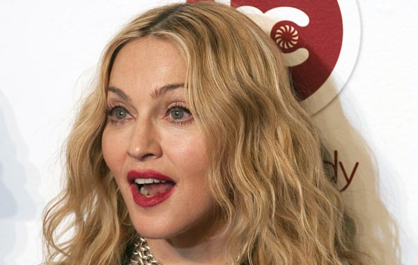 US singer Madonna poses for photographers during the opening of her Gym called "Hard Candy Fitness" in Mexico City. (AFP)