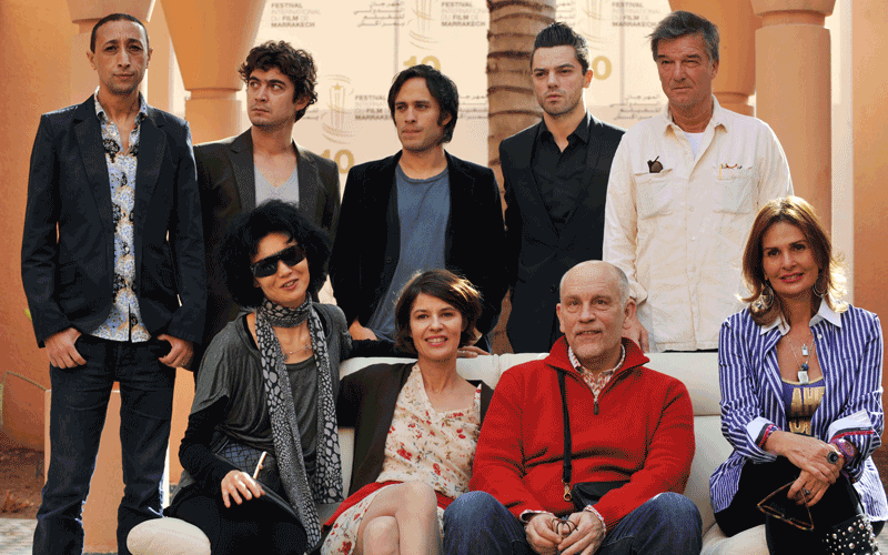 Members of the jury (bottom row left to right) Hongkongese actress Maggi Cheung, French actress Irene Jacob, US actor, director and president of the jury John Malkovich, Egyptian actress Yousra, (top rown, left to right) Moroccan director Faouzi  Bensaidi, Italian actor Riccardo Scamarcio, Mexican actor Gael Garcia Bernal, English actor Dominic Cooper and French director Benoit Jacqot pose during a photocall at the 10th edition of the Marrakech International Film Festival. (AFP)