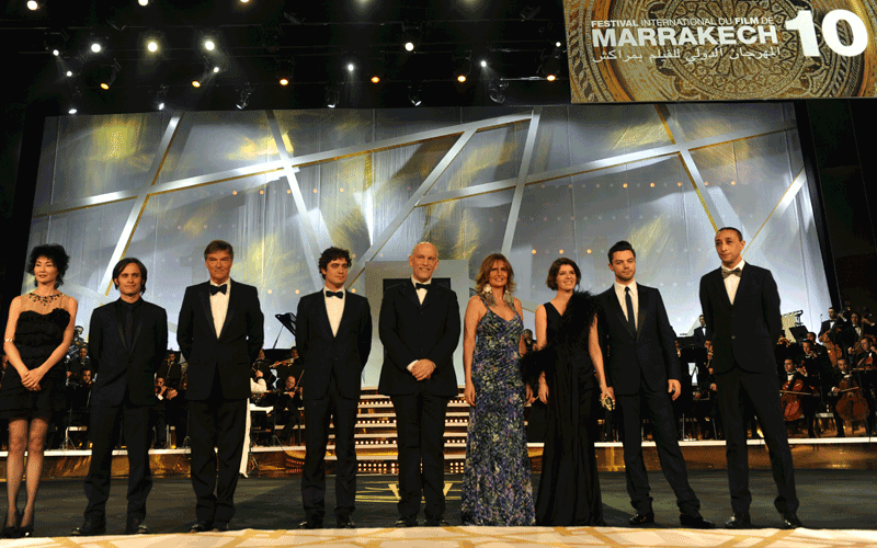 Marrakech film festival Jury Menbers (left-right) Maggie Cheung, Garcia Gael Bernal, Benoit Jacquot, Ricardo Camarcio, Barry Levinson, John Malkovich, Yousra, Irene Jacob, Dominic Cooper and Faouzi Bensaidi attend the Marrakech 10th International Film Festival opening ceremony in Marrakech. (AFP)