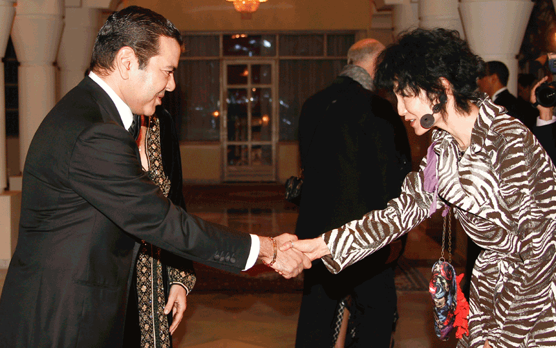 Hong Kong actress Maggie Cheung, right, a jury member of the 10th Marrakech International Film Festival, shakes hands with Morocco's Prince Moulay Rachid in Marrakesh, Morocco. The festival runs through Dec. 3-11 and this year focuses on new films from Eastern Europe and Asia. (AP)