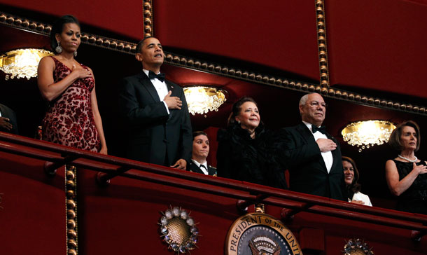 US President Barack Obama (2nd L) and first lady Michelle Obama stand with Colin Powell and his wife Alma and Speaker of the House Nancy Pelosi (R) during the Kennedy Center Honors in Washington. (REUTERS)