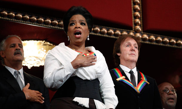 Recipients of the  2010 Kennedy Center Honors, Oprah Winfrey, and Paul McCartney, sing the National Anthem during the 2010 Kennedy Center Honors Gala at the Kennedy Center in Washington. Others are Stedman Graham, back left, and Trade Representative Ron Kirk, back right.  (AP)