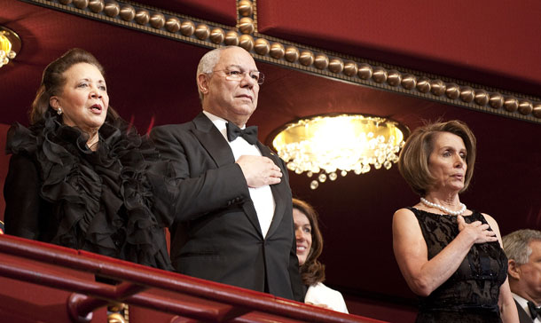 Former Secretary of State Colin Powell (2L) and his wife Alma (L) and Speaker of the House Nancy Pelosi (R) stand for the US National Anthem during the Kennedy Center Honors in Washington, DC. Recipients to be honored at the 33rd annual national celebration of the arts are: singer and songwriter Merle Haggard; composer and lyricist Jerry Herman; dancer, choreographer and director Bill T. Jones; songwriter and musician Paul McCartney; and producer, television host and actress Oprah Winfrey. (AFP)