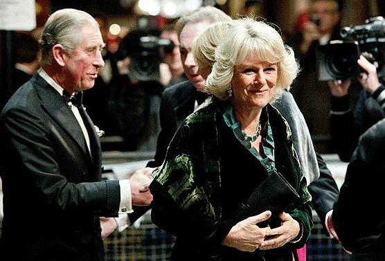 Putting on a brave front: Prince Charles, Prince of Wales and Camilla, Duchess of Cornwall are greeted after the attack on their car on Thursday night (GETTY)