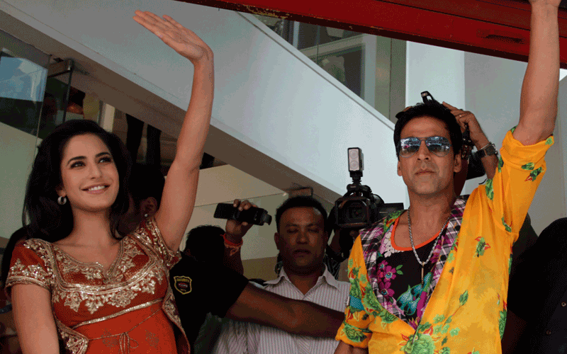 Bollywood actors Akshay Kumar, right and Katrina Kaif wave during a promotion of their upcoming movie "Tees Maar khan" in Ahmadabad, India. The movie is scheduled to be released on Dec. 24. (AP)