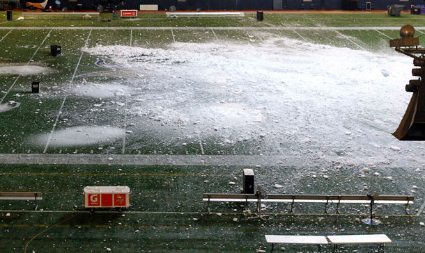 Snow has fallen through a hole in the roof of the  Metrodome and can be seen on the field in Minneapolis. The inflatable roof of the Metrodome collapsed Sunday after a snowstorm that dumped 17 inches on Minneapolis. No one was hurt, but the roof failure sent the NFL scrambling to find a new venue for the Vikings' game against the New York Giants. (AP)