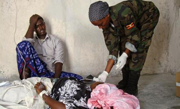 An Ugandan peacekeeper treats patients at a military hospital in the capital Mogadishu. (REUTERS)