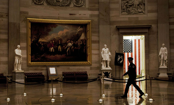 A Capitol Police Officer walks through the rotunda of the Capitol Building on Capitol Hill in Washington, DC. The US Senate is expected to vote on H.R. 4853, the Middle Class Tax Relief Act of 2010, which would extend the Bush-era tax cuts another two years before the end of the 111th Congress. (AFP)