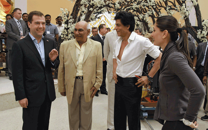 Russia's President Dmitry Medvedev (L) talks to an Indian actor Shah Rukh Khan (2nd R) and Indian producer and director Yash Chopra (2nd L) as he visits a Bollywood studio in Mumbai. (REUTERS)