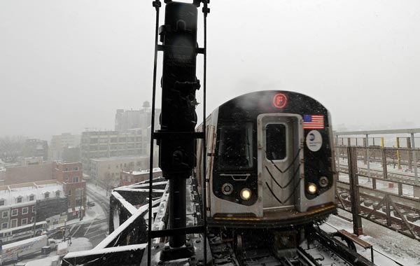 The F-train pulls into the station at Smith and Ninth street on in New York City. (AFP)