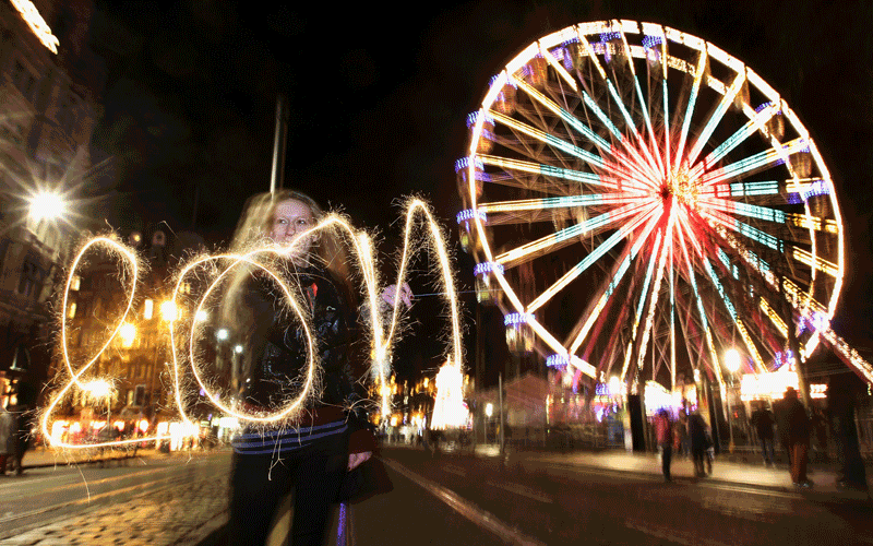 New Year revellers gather on Princes Street ahead of the New Year celebrations in Edinburgh, Scotland. It is expected that around eighty thousand people will attend the festivities in Scotland's capital. (Getty Images)