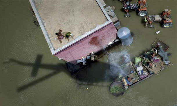 An Army helicopter drops relief supplies to flood victims in Pakistan's Rajanpur district in Punjab province. (REUTERS)