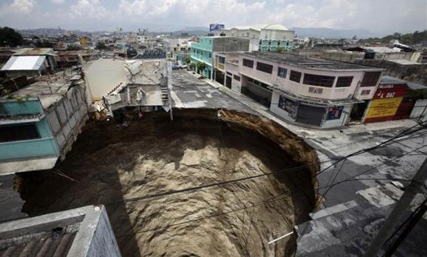 A giant sinkhole caused by the rains of tropical storm Agatha is seen in Guatemala City. (REUTERS)