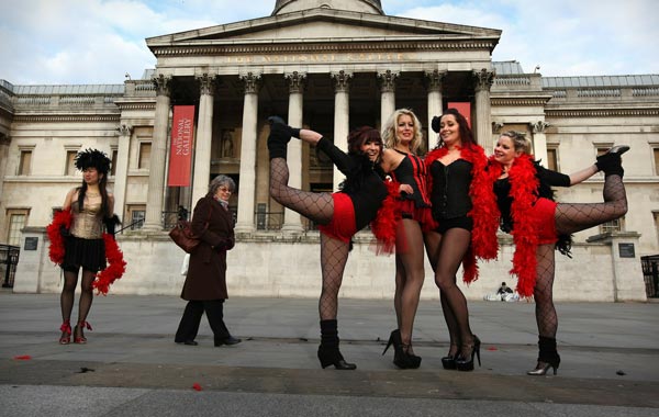 Dancers pose for photographs after attempting to break the record for the world's largest burlesque dance in Trafalgar Square on January 3, 2011 in London, England. The dance troop, made up of Virgin Holiday staff and burlesque enthusiasts, took part in a five minute routine. (GETTY)