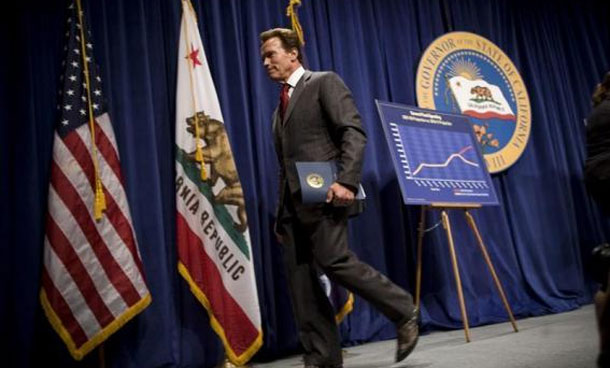 California Governor Arnold Schwarzenegger exits the stage after proposing his $83.4 billion state budget plan in Sacramento, California. (REUTERS)