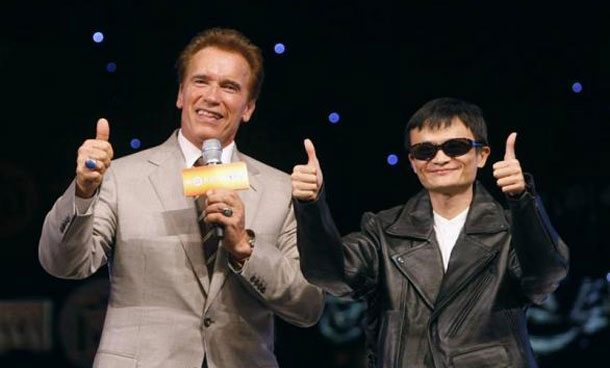 Alibaba Group's chief executive Jack Ma (R) and California Governor Arnold Schwarzenegger pose during Alibaba Group's annual summit for e-commerce entrepreneurs in Hangzhou, Zhejiang province, China. (REUTERS)