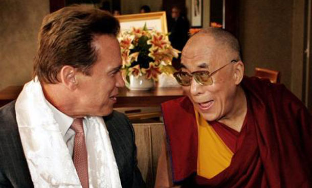 The Dalai Lama (R) speaks with California Governor Arnold Schwarzenegger in Long Beach, California. (REUTERS)