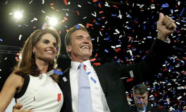 California Republican governor-elect Arnold Schwarzenegger and his wife Maria Shriver wave to their supporters before his acceptance speech in Los Angeles. (REUTERS)